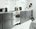 Gray_Kitchen_Cabinets_With_Arrangement,_White_Backsplash-